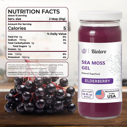 Sea moss gel bottle with nutrition facts label and elderberries on a wooden surface