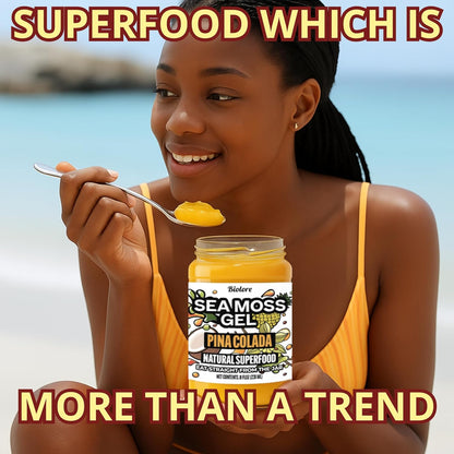 Woman eating Biolore pina colada sea moss gel by the beach representing a natural superfood lifestyle.