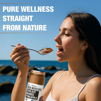 Woman eating Biolore sea moss gel with shilajit mango pineapple flavor by the ocean.